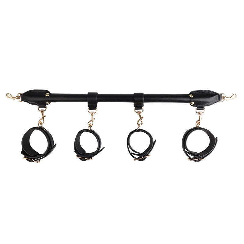 Esparcidor BDSM, extendido con esposas para manos y pies.