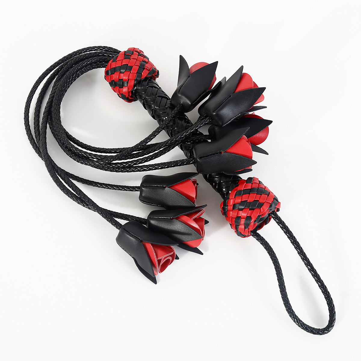 Flogger, whip and leather with roses