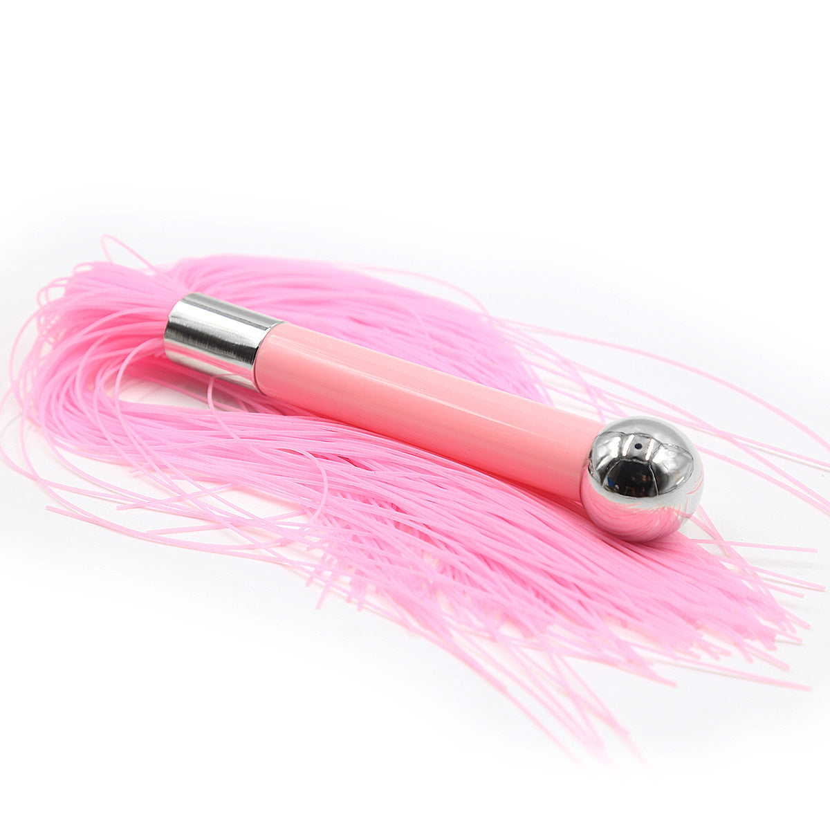 Flogger, whip and pink silicone