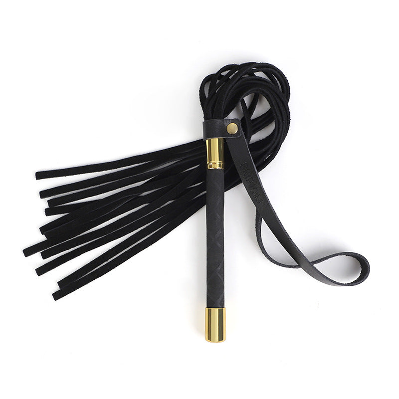 Luxurious flogger, whip in black genuine leather with brass details