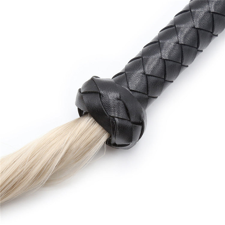 Flogger, whip in black leather with hair