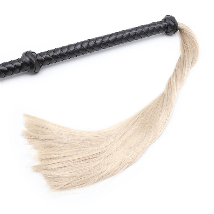 Flogger, whip in black leather with hair