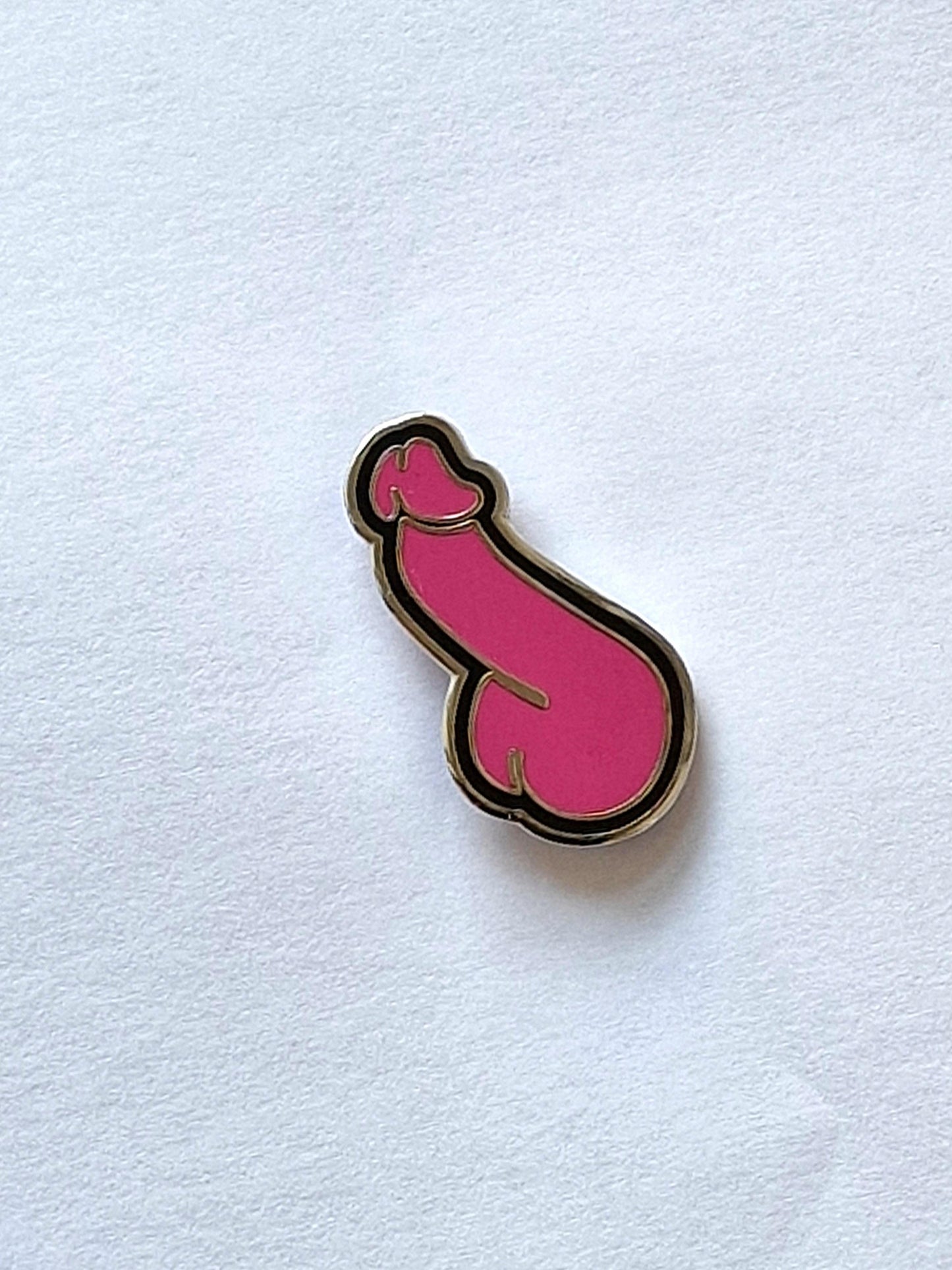 Pin único y divertido, polla rosa y negra.