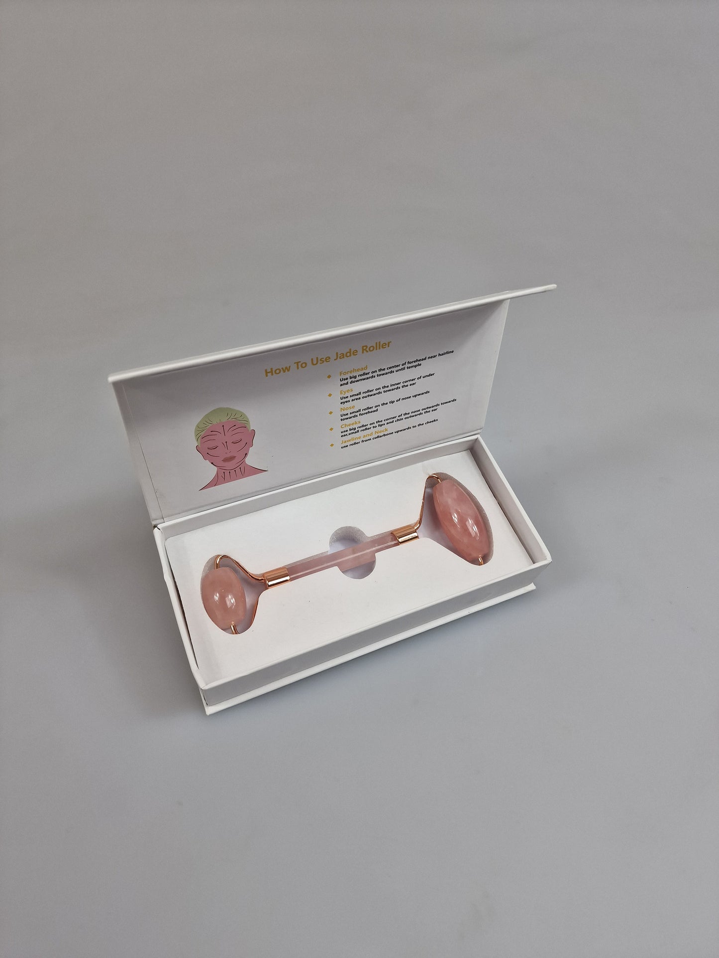 Rodillo facial Rose Quarts gua sha jade o rodillos faciales en cuarzo rosa.