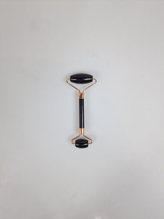 Gua sha jade face roller or face roller in black onyx.
