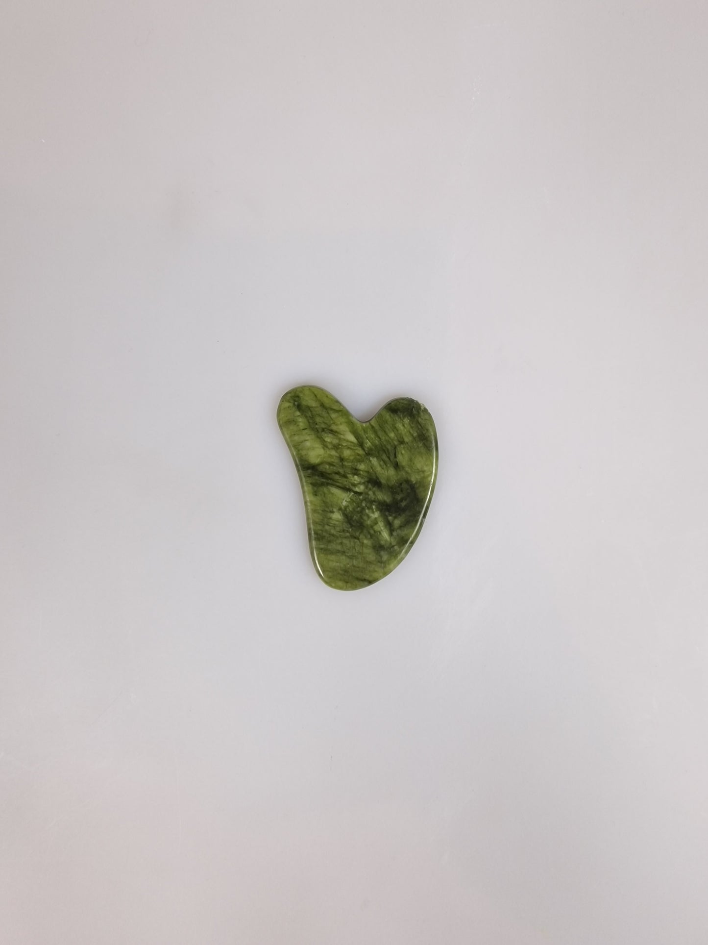 Ansiktsskrapa. Face scrapers. Green mashan jade.