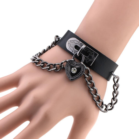 Leather armband with black chains and heart with crystal