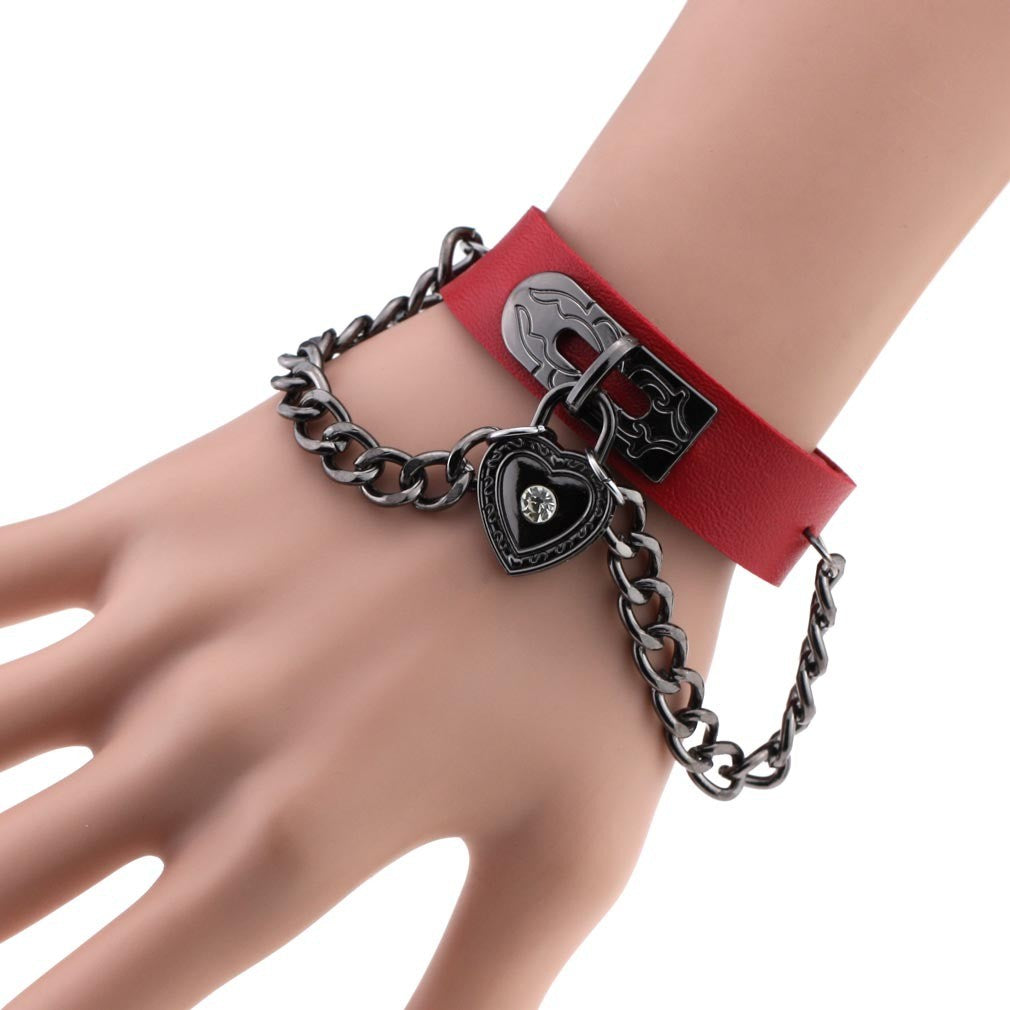 Leather armband with black chains and heart with crystal