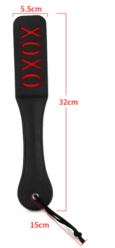 Paddle whip in leather, whipping tool, with the text "XOXO" cut out
