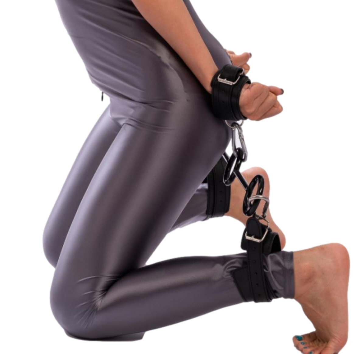 Spreaders, wrist cuffs and ankle cuffs in vegan leather attached to a leather covered metal rod with brass fasteners. An exciting sex aid and fetish sex toy.