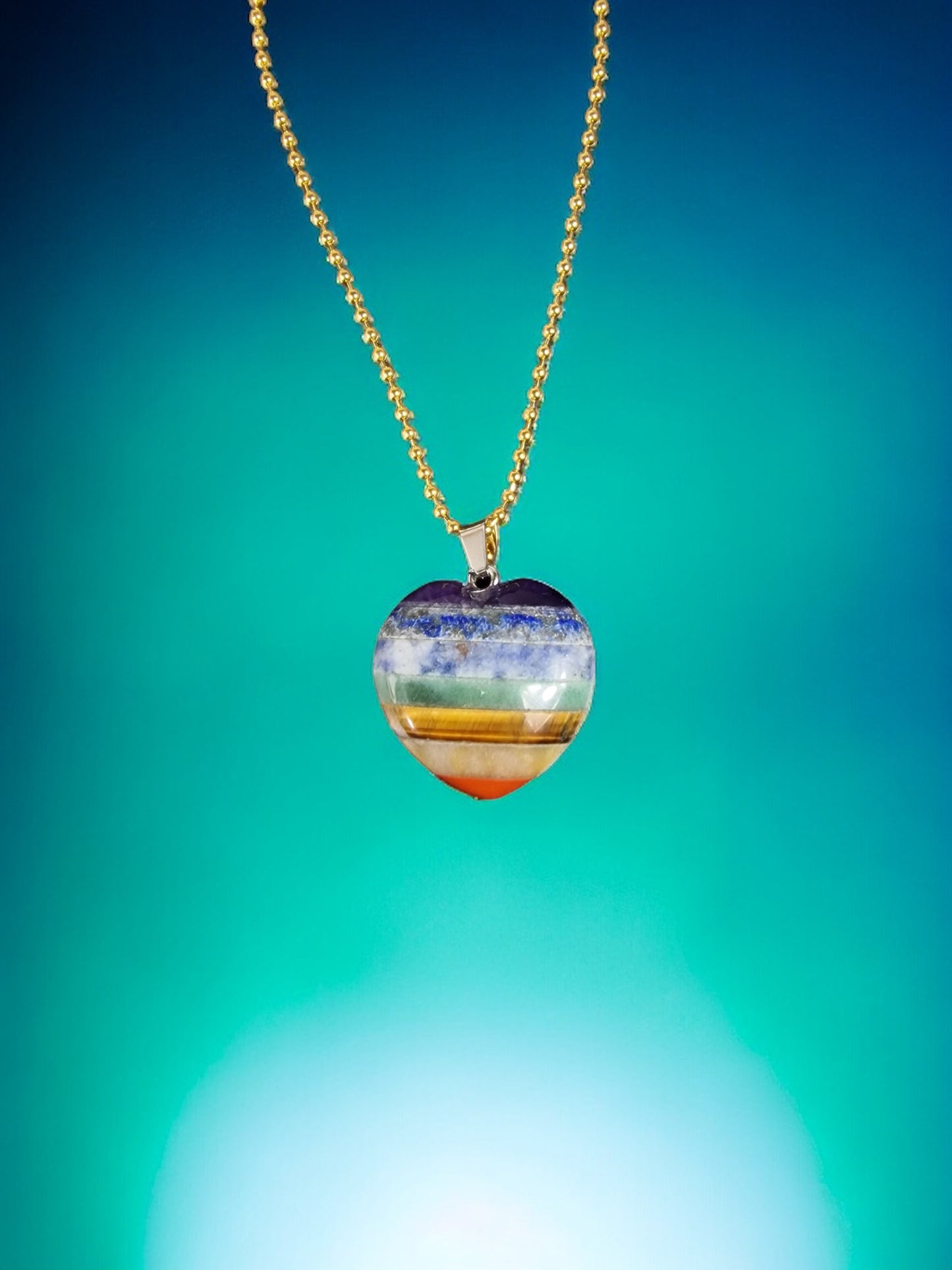 Necklace with rainbow colored heart. A seven chakra necklace