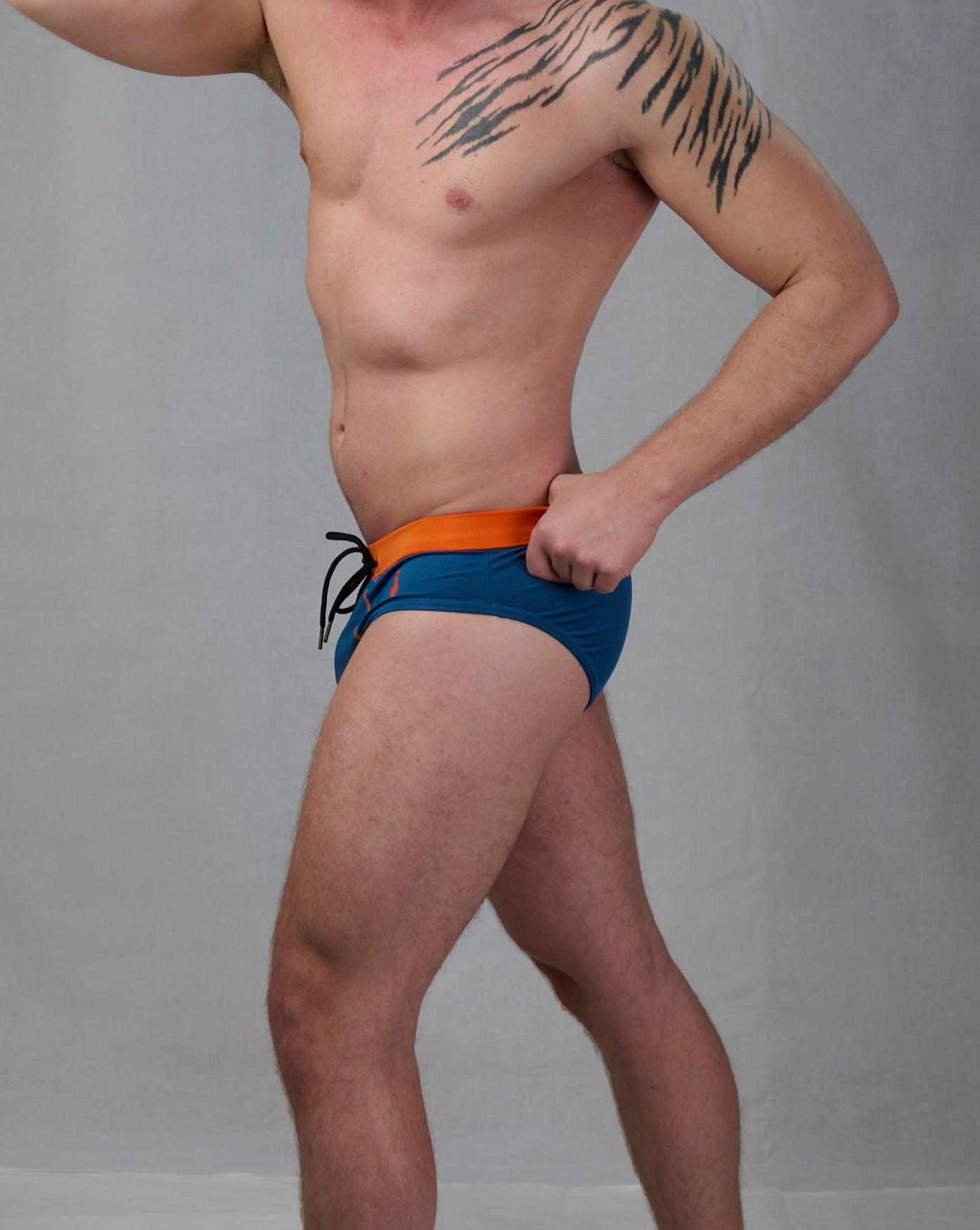 Badbyxor, swim speedos med orange linning och blå byxa, med push up