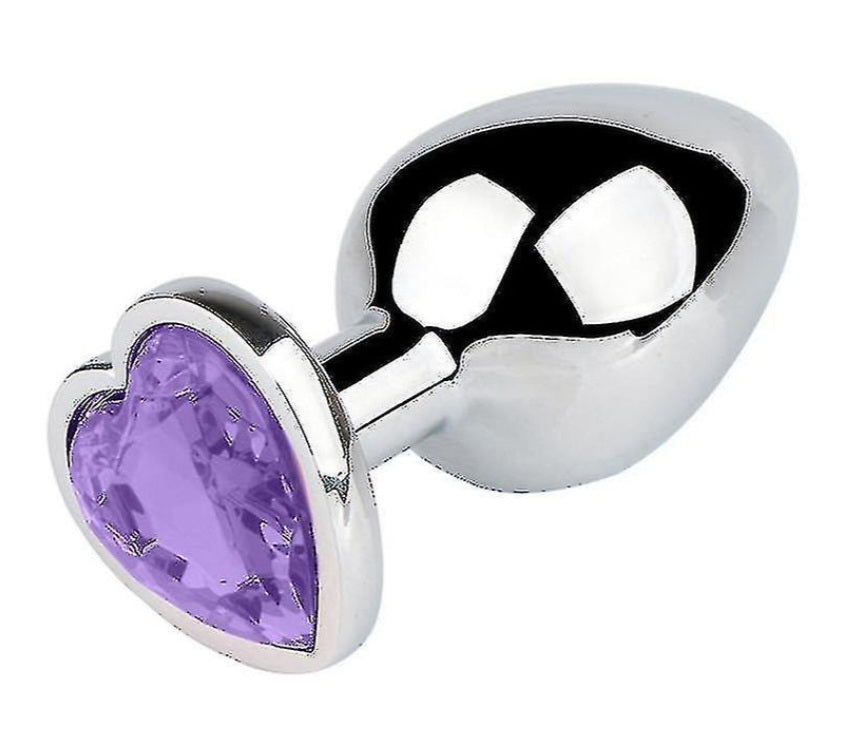 Buttplug i nickelfritt guld eller silverfärgat stål med kristallhjärtan i rosa, lila, blått och transparent färg