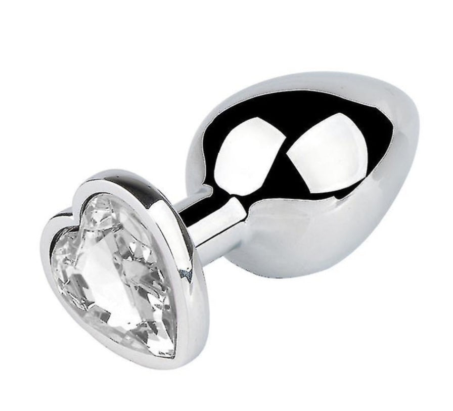 Buttplug i nickelfritt guld eller silverfärgat stål med kristallhjärtan i rosa, lila, blått och transparent färg