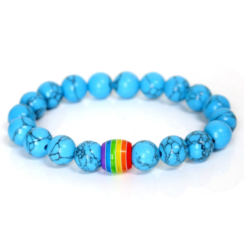 Armband in turquoise crystals and pride bead