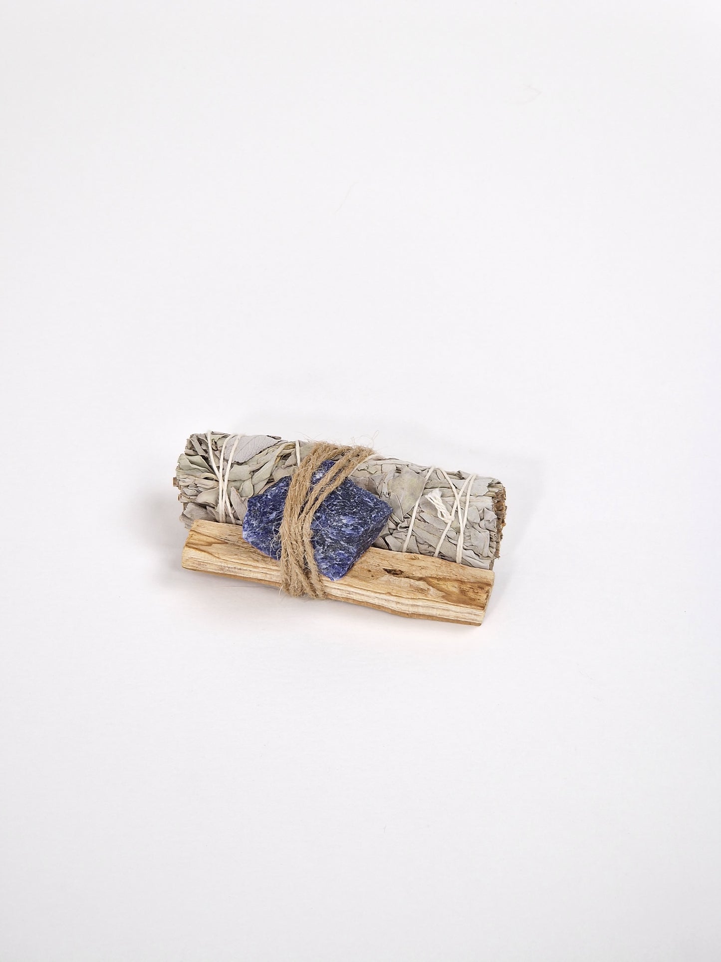 Sodalite, sodalite crystal with white sage smudge stick and Palo Santo, sacred wood