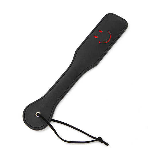 Padle, pisk for BDSM i skinn