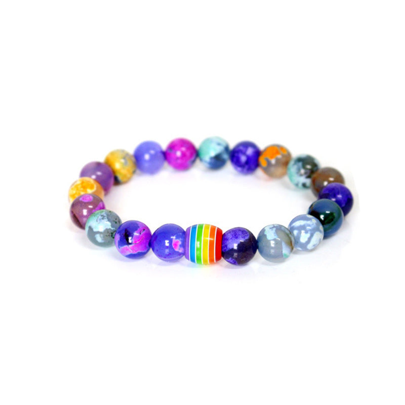 Armband in schwarzem Lavastein und Pride-Perle