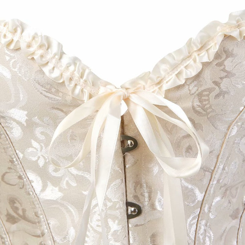 Gräddvit korsett med spets och snörning