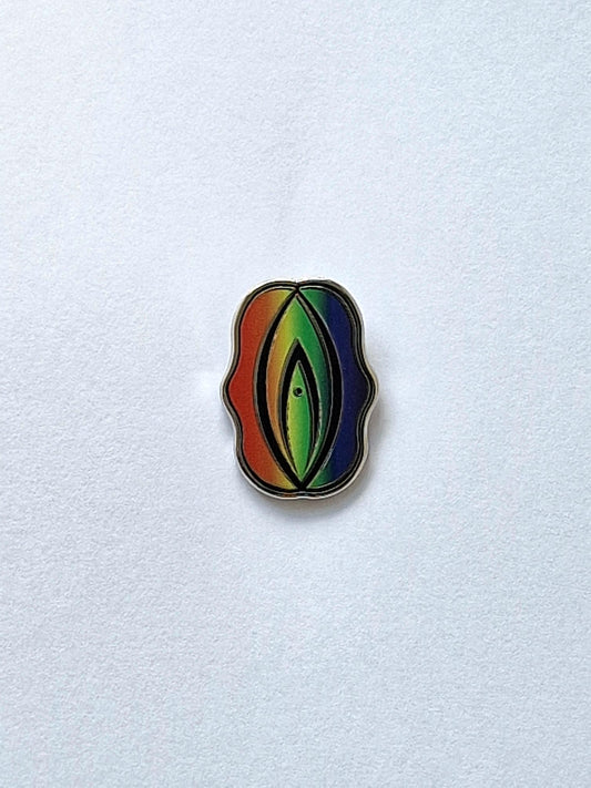 A fun, proud and personal pride pin shaped like a rainbow colored pride pin or snipe.