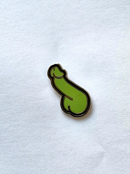 A fun and different pin in the shape of a green and black dick.