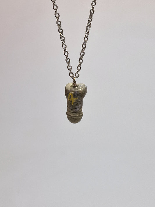Unique necklace with a pendant made of the crystal pyrite