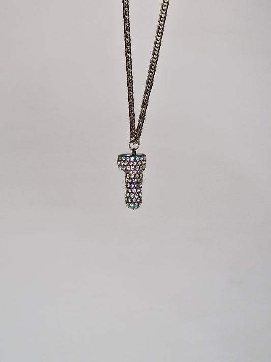 A unique necklace in multicolor metal covered with crystals and shaped like a penis or cock