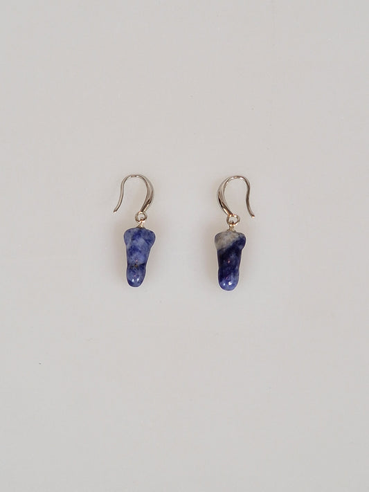 Earring of the blue crystal or semi-precious stone sodalite