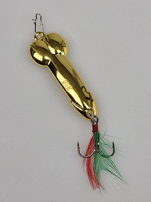 Señuelo de pesca tipo pene con plumas en color dorado.