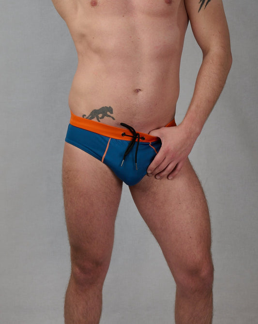 Swim speedos with orange waistband and blue pants, a swimming trunk with push up