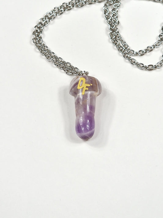 A different necklace with a pendant in the crystal amethyst.