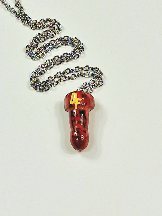 A unique and beautiful necklace with a cock or penis of red jasper crystal