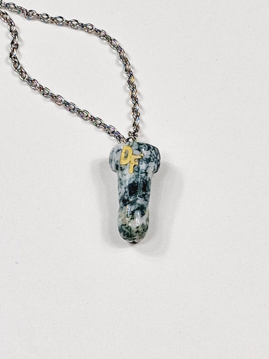 Necklace with a pendant shaped like a dick or penis made of crystal wood