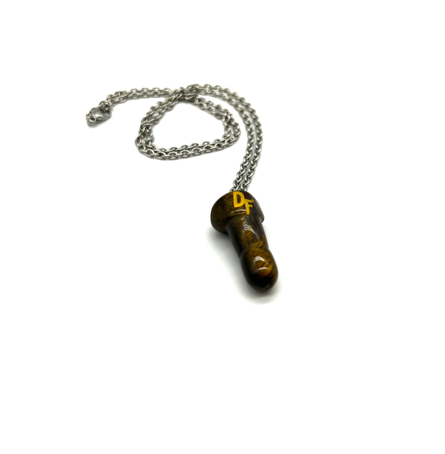 Halsband med olika kristaller eller stenar formade som en dick